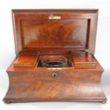 A 19th century mahogany sarcophagus tea caddy with original caddys and a mixing bowl, 37cm w x