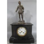 A Victorian black slate mantle clock with eight day striking movement, surmounted by a spelter