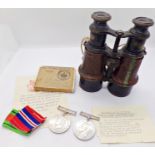 A pair of WWI military binoculars, together with WWII defence medal, 39-45 War Medal