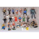 Collection of small character figures including 14 Herge figures from the Tin Tin stories, various