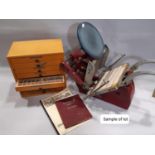 A vintage Adana table top letter press together with a quantity of letter type and accessories, a