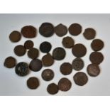 A collection of ancient world coins in bronze with some old paper listings