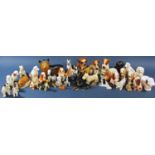 A collection of small models of dogs in various poses, various breeds, by different makers (40