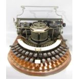 A Hammond Typewriter USA circa 1895 with the Ideal Keyboard with original oak carry case.