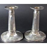 A pair of silver octagonal column candlesticks with flared bases, Sheffield 1919, maker James