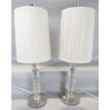 A pair of perspex column table lamps in five octagonal segments, with pleated shades 55cm tall inc