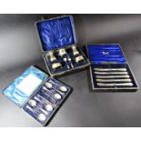 A cased set of six condiments, seven pieces in total (AF), a cased set of five butter knives, a