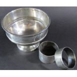 A Walker & Hall silver bowl, Sheffield 1904, 10.5cm diameter and two silver napkin rings, 6.5oz