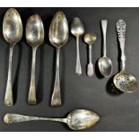 Four 19th century silver serving spoons of varying dates and makers, two teaspoons, a mustard