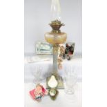 A late 19th century column oil lamp with cut glass font and further brass fittings, together with