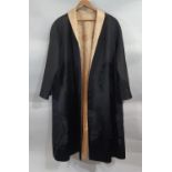Reversible Chinese robe in black and gold damask silk patterned with roundel motifs length 109cm