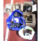 Photographic equipment: a large quantity of cameras, slide projectors, video cameras, a pair of loud