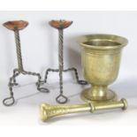 A 19th century brass pestle and mortar and a pair of Arts and Crafts tripod wire twist