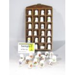 A large quantity of collectors thimbles, all late 20th century, the majority in porcelain with small