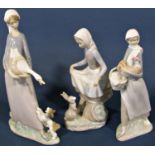 Four Lladro figures comprising a girl with a goose and a puppy, girl with a rabbit, girl with a hen