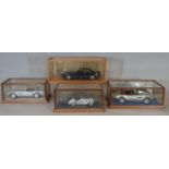 4 cased models of BMW cars comprising 1:18 scale 850i by Revell in timber/perspex case, BMW 507 by