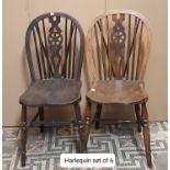 A Harlequin set of six Windsor wheelback dining chairs in elm and beech