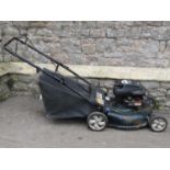 A Bolens MTD petrol driven rotary push mower with Briggs & Stratton engine and 21 inch cutting deck