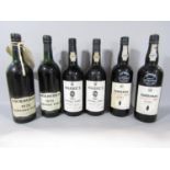 Six bottles of vintage port comprising Cockburn's 1970, two bottles of Sandeman vintage 1977, two