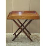 19th century mahogany rectangular butlers tray raised on a simple folding stand, 80cm x 55cm