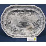 A large ironstone china meat platter with transfer ware decoration showing a rhinoceros and