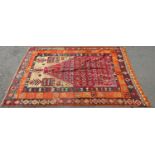 A North African Kilim Prayer Mat with three concentric geometric borders, 210cm x 140cm approx.