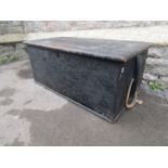 An antique stained oak seamans type chest with hinged lid, painted interior and rope twist side