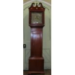 A Georgian mahogany longcase clock, the hood enclosing a square brass dial and eight day striking