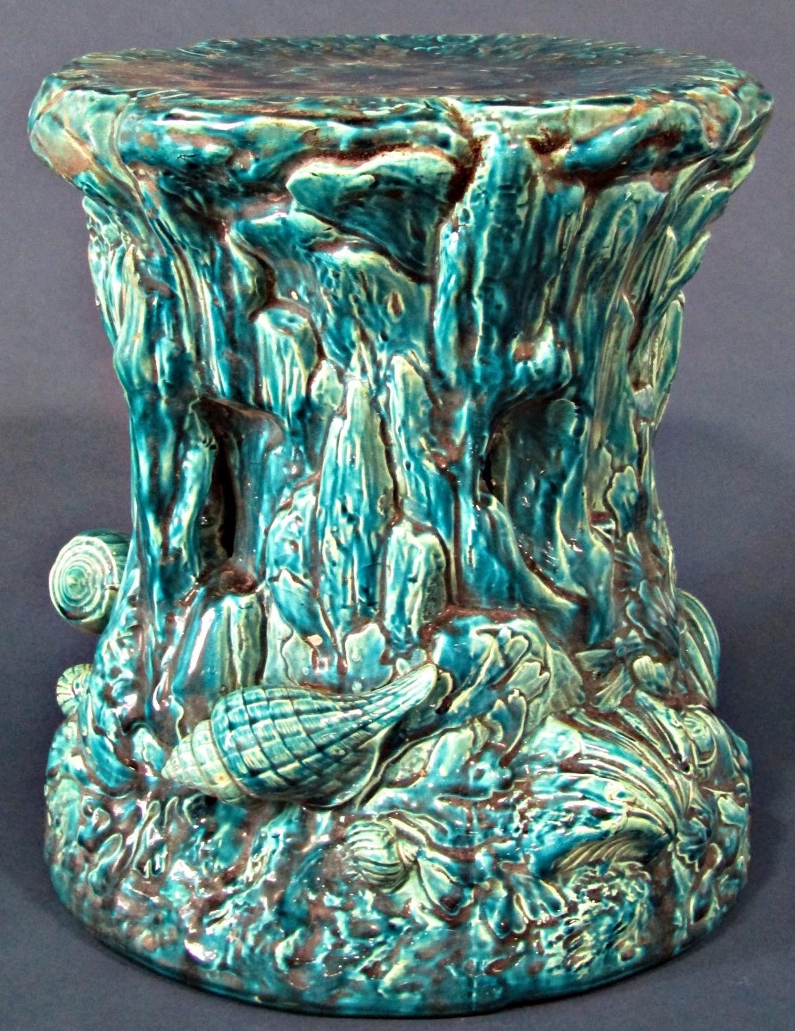 A Bretby ware majolica jardinière stand with marine theme, with shell, weed and other detail, with