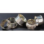 A mixed selection of silver and silver plate, including three silver napkin rings, two plated ladles