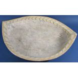 A large ovoid shaped studio pottery dish set within two herring bone bands and central panel with