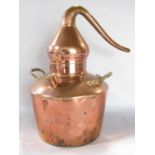 A vintage copper distiller with brass handles, 39cm high.