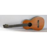 A small six string acoustic Spanish guitar