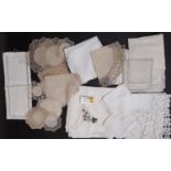 Small boxful of vintage table linen including good quality white cloths with embroidery, lace