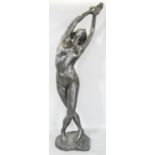 A bronze effect statue of a female nude in a balletic pose, 60cm tall.
