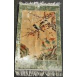 A Chinese fine silk rug with birds amongst cherry blossom. 95cm x 62cm approx.