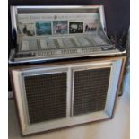 A Seeburg stereo console jukebox - 160 selections in simulated teak and bright chrome casework,