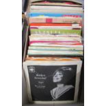 A collection of 45rpm vinyl to include Barbara Streisand, Nat King Cole, Dean Martin, Eartha Kit,