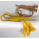 A copper and brass bugle from the “ Church Lads Brigade” 13 Craven Street, and yellow tassel