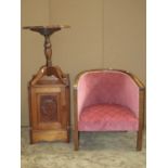 A low oak framed tub chair with pink upholstery, together with a carved oak single chair with vase