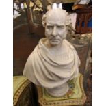 A large 19th century plaster bust of a male character with side burns and toga, 75cm high