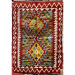 A Chobi Kilim with a repeating diamond pattern 120cm x 84cm approx.