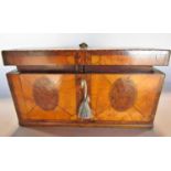 An 18th century satinwood tea caddy, with oval burr walnut panels with rosewood banding , cross