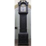 An early 19th century oak longcase clock, the casework with later geometric carved detail, enclosing
