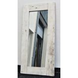 A rustic framed mirror with painted finish, 72 cm x 150 cm approx