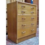A collection of G plan oak furniture, comprising a tower of five drawers, a dressing table