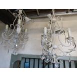 A pair of contemporary light metal three branch chandeliers with decorative painted crazed finish,