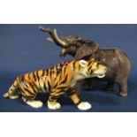 A collection of miscellaneous effects to include a bull elephant, a Royal Dux tiger, three Beswick