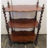 A Victorian mahogany three tier watnot, with shaped shelves and barley twist supports, 90cm high x