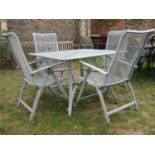 A contemporary mat painted cast alloy five piece garden terrace set comprising a square topped table